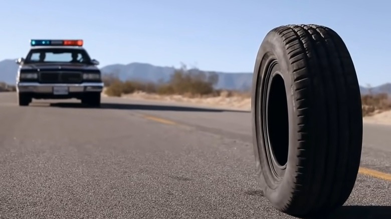 black tire paved road cop car