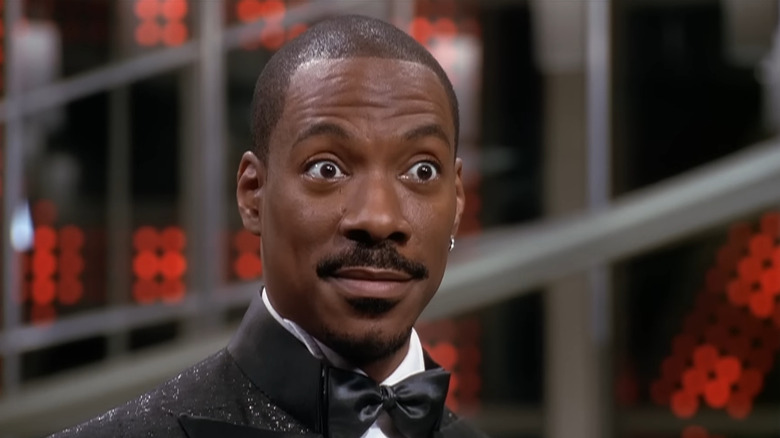 Eddie Murphy as Pluto Nash raising his eyebrows in The Adventures of Pluto Nash