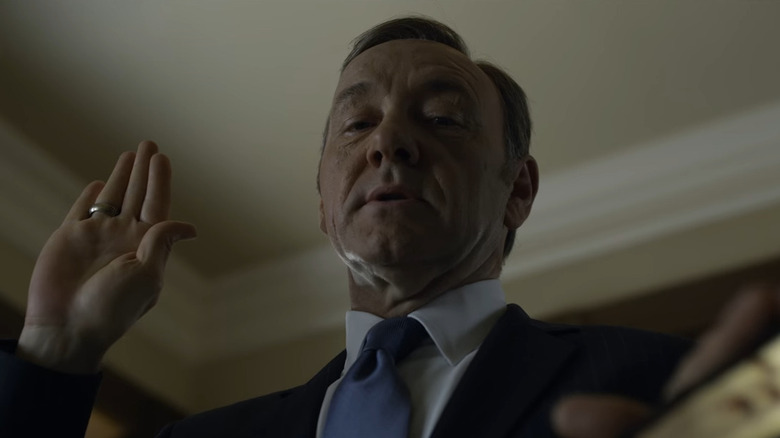 Kevin Spacey as Frank Underwood pledging allegiance on House of Cards