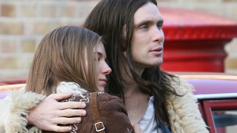 Cillian Murphy and Sienna Miller hugging while filming Hippie Hippie Shake