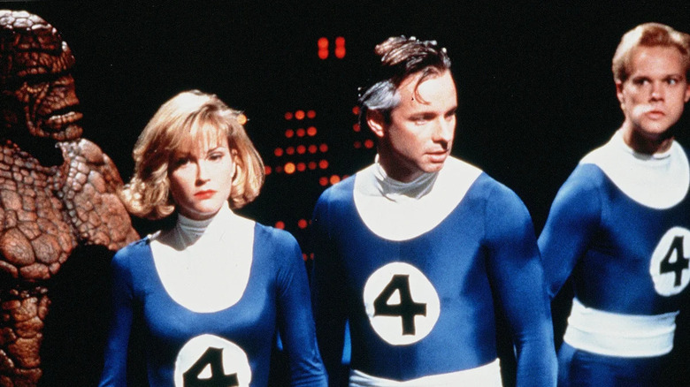 Carl Ciarfalio as The Thing, Rebecca Staab as Susan Storm, Alex Hyde-White as Reed Richards, and Jay Underwood as Johnny Storm standing together in Fantastic Four