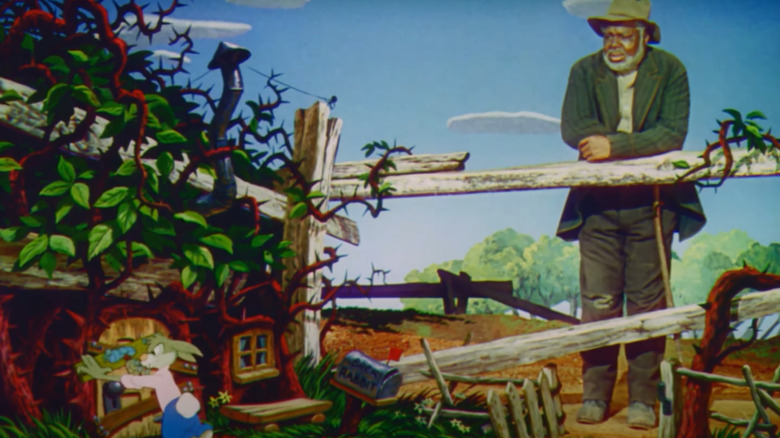 James Baskett as Uncle Remus, with Brer Rabbit talking in Song of the South