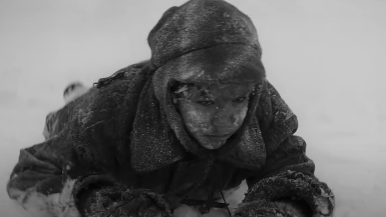 Petr Kotlar as Joska crawling in snow in The Painted Bird