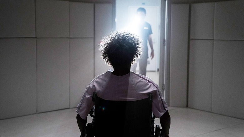 Samuel L. Jackson as Glass lies in wait for a doctor's aide in Glass