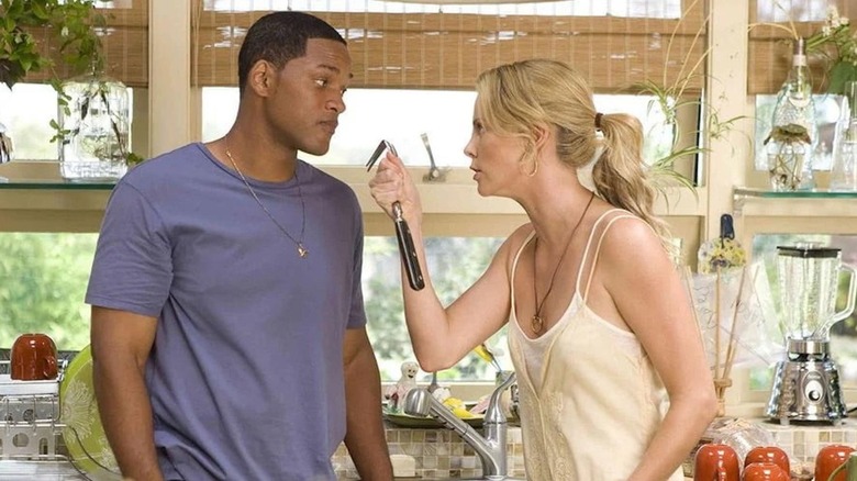 Hancock (Will Smith) and Mary (Charlize Theron) have a conversation in her kitchen in Hancock