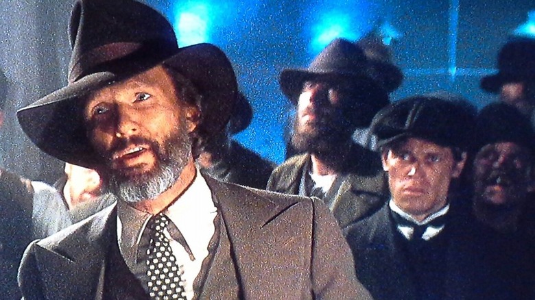 Averill talking with Willem Dafoe behind him in Heaven's Gate