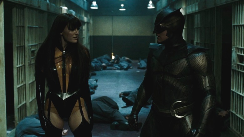 Silk Spectre and Nite Owl standing in hallway