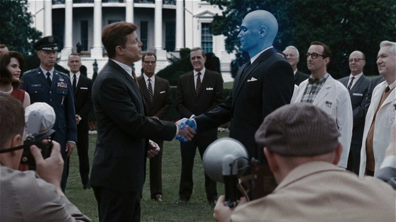 Dr. Manhattan shaking President Kennedy's hand