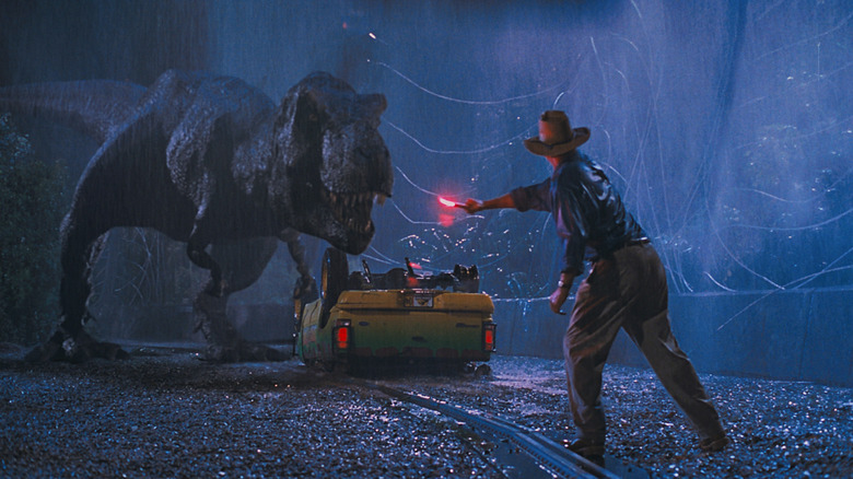 Alan using flare to distract T-Rex in Jurassic Park