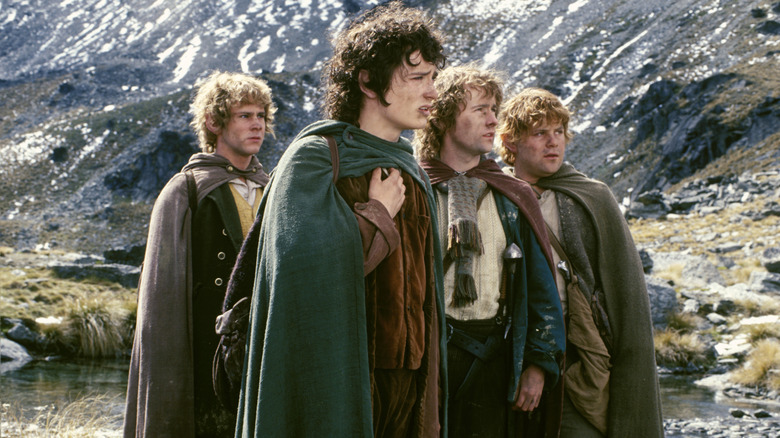 Merry, Frodo, Pippin, and Sam in the mountains in Lord of the Rings: The Fellowship of the Ring