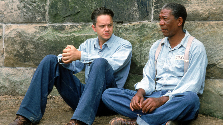 Andy and Red sitting on the ground in The Shawshank Redemption