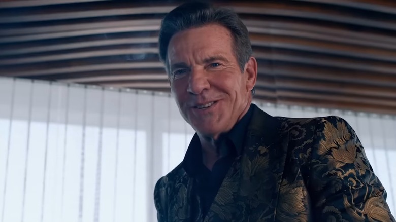 Harvey (Dennis Quaid), wearing a gold embroidered jacket, in The Substance