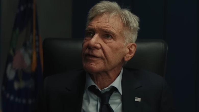 President Thaddeus Ross (Harrison Ford), looking frustrated with his tie loose, in Captain America: Brave New World