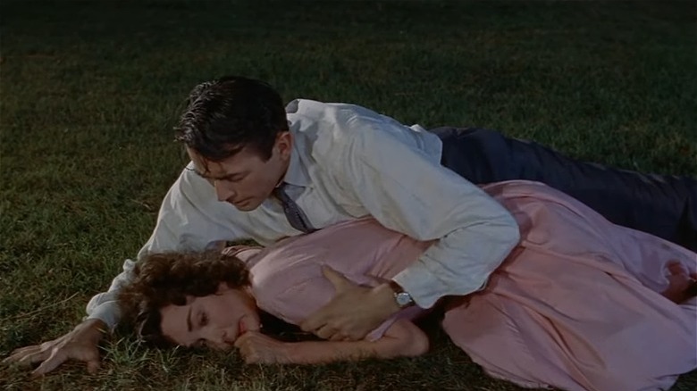 Gregory Peck Jennifer Jones laying in grass Man in Gray Flannel Suit