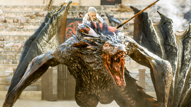 Emilia Clarke as Daenerys riding dragon