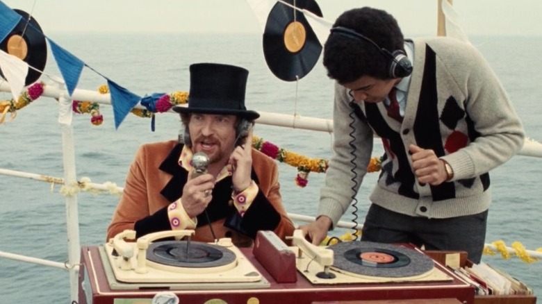 To men DJing on boat