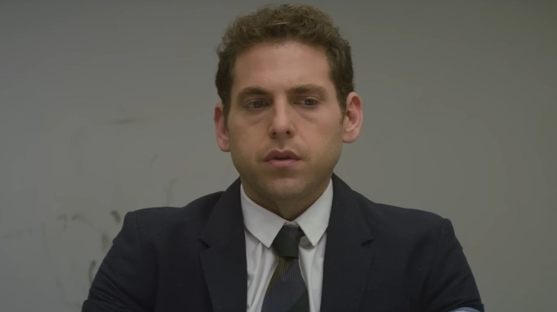 John Hill as Owen Milgrim, looking down during a deposition on Netflix's Maniac