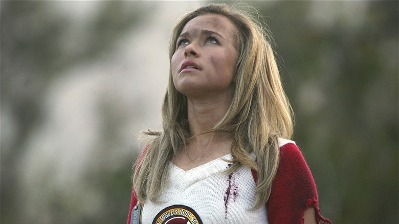 Hayden Panettiere covered in dirt looking up