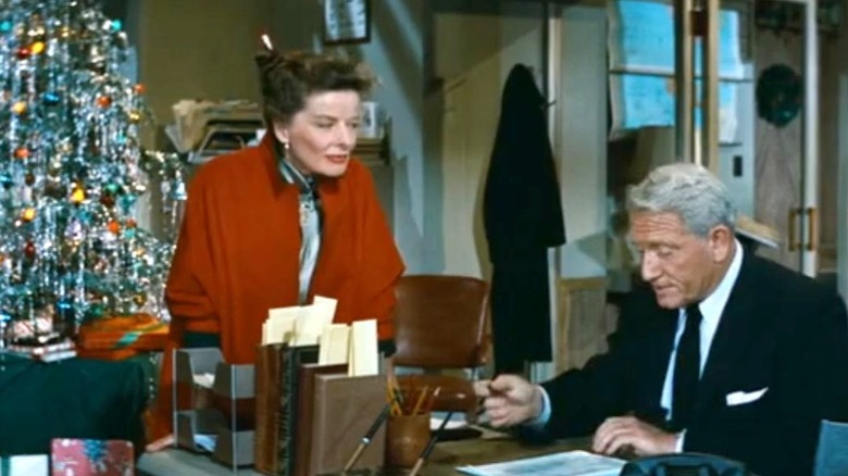 Katharine Hepburn and Spencer Tracy in front of Christmas tree