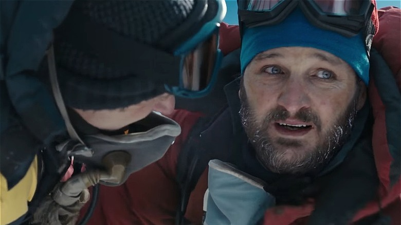 Jason Clarke coat goggles beard snow