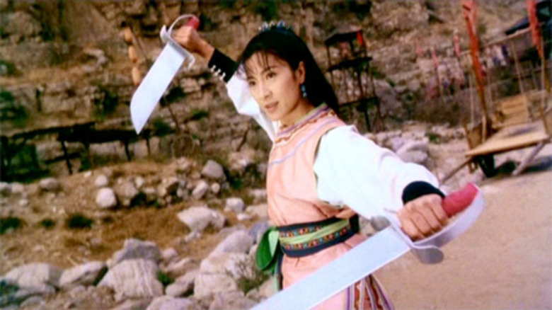 Michelle Yeoh holding two swords in Wing Chun