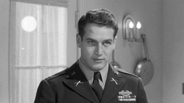 The Rack's Paul Newman standing in military uniform