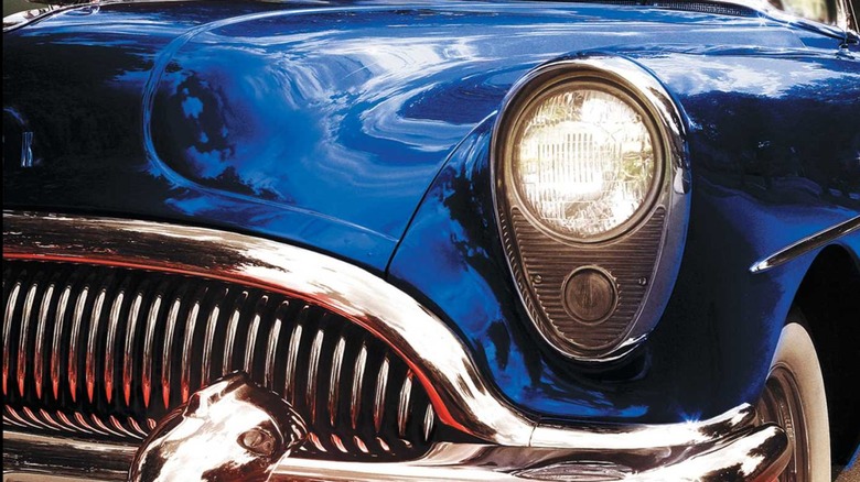 The feral grill of a blue Buick Roadmaster, in a cover for From A Buick 8