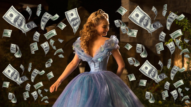 Lily James as Ella surrounded by money in Cinderella (2015)