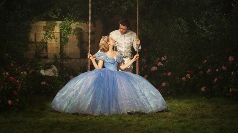 Richard Madden's Prince Charming pushing Lily James' Cinderella on the swing in Cinderella (2015)