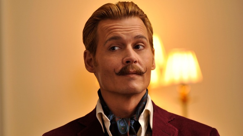 Johnny Depp as Charlie Mortdecai furrowing his brow in Mortedecai