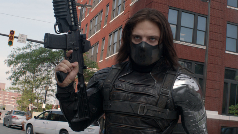 Bucky Barnes stands armed and masked in Captain America: The Winter Soldier