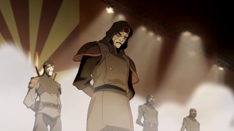 Amon and the Lieutenant standing on stage with other Equalists in The Legend of Korra