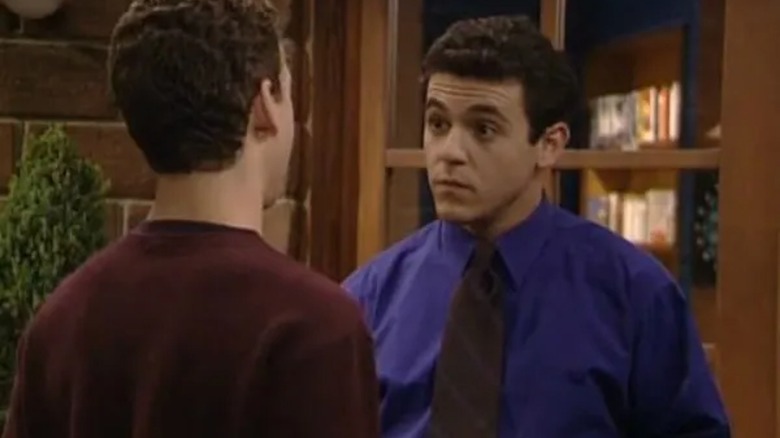 Fred Savage's Stuart speaks to Ben Savage's Cory (facing away from camera) in Boy Meets World