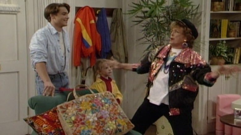 Will Friedle's Eric and Lily Nicksay's Morgan watch Rue McClanahan's grandma make theatrical gestures in the living room in Boy Meets World