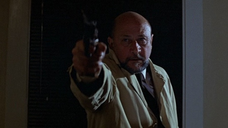 Dr. Loomis pointing a gun in Halloween