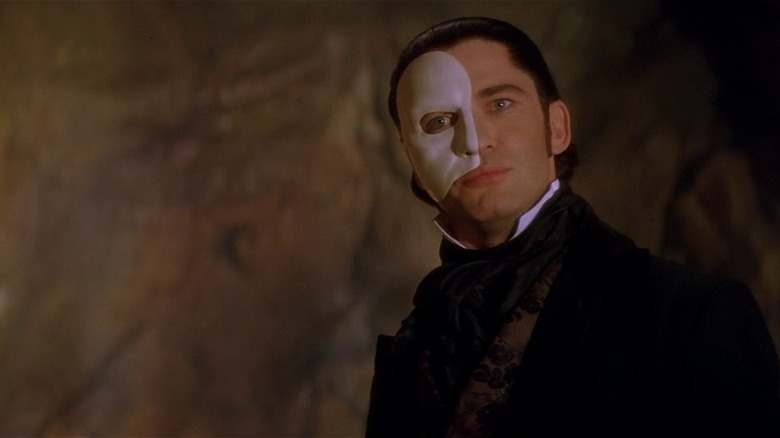 The Phanton of the Opera's Phantom scowling with half-masked face