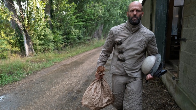 Jason Statham as Adam Clay heading to work in The Beekeeper