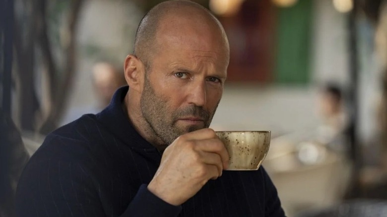 Jason Statham as Orson Fortune enjoying a coffee in Operation Fortune