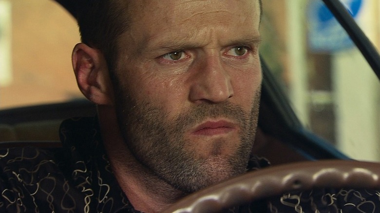 Jason Statham as Chev Chelios grimacing in Crank