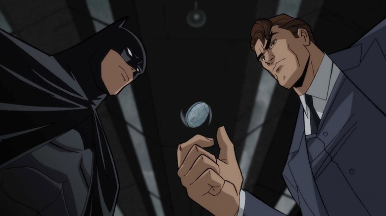 Batman and Harvey Dent look down on a flipping coin in the animated film Batman: The Long Halloween Part I