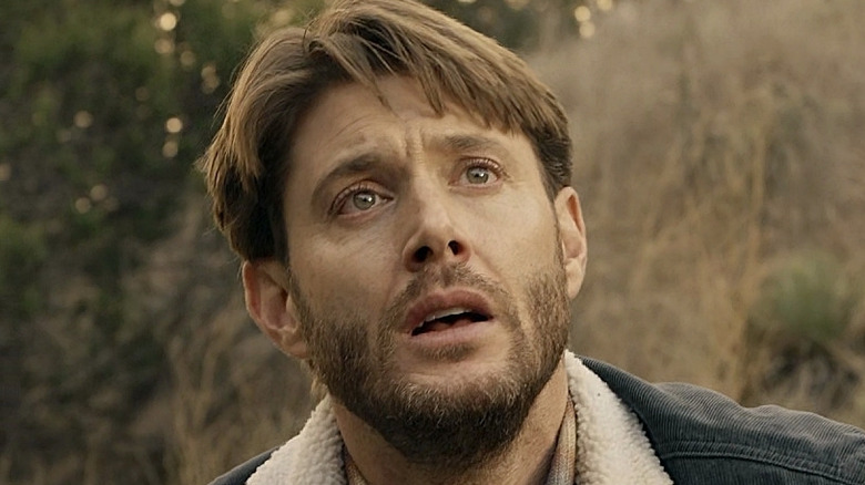 Jensen Ackles as Beau Arlen, teary eyed and looking upward on Big Sky