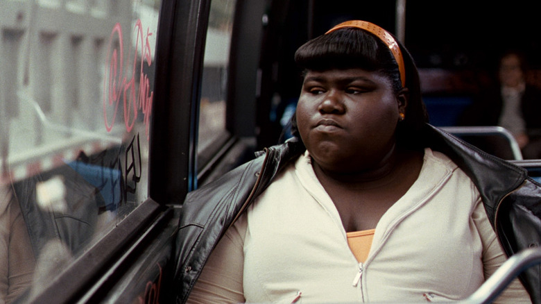 Precious (Gabourey Sidibe) looks through a bus window in Precious