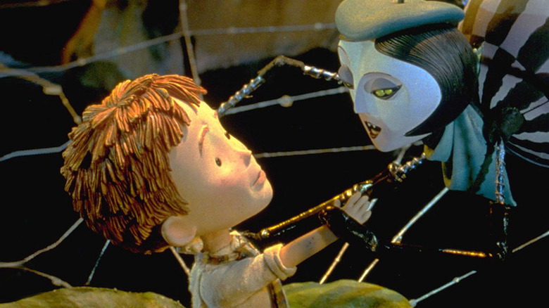 Spider (Susan Sarandon) holds hands with James Henry Trotter (Paul Terry) in James and the Giant Peach