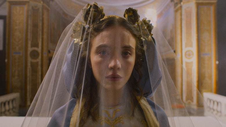 Sydney Sweeney as Sister Cecilia looking at the camera in an ornate veil in Immaculate