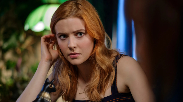 Nancy Drew (Kennedy McMann) brushes her hair behind her ear in Nancy Drew (2019)