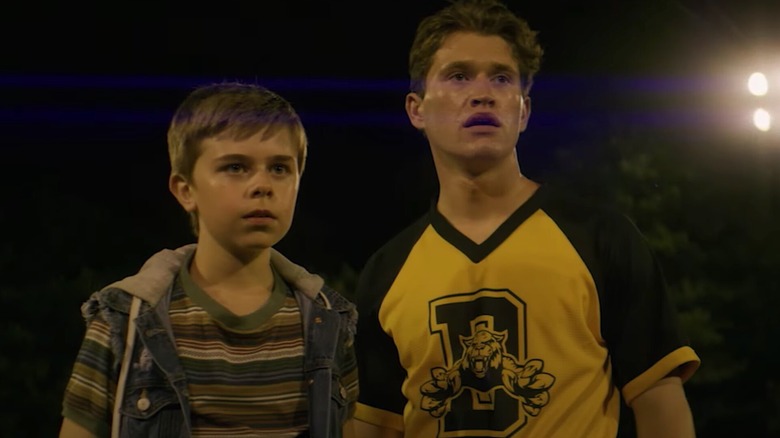 Frank (Rohan Campbell) and Joe Hardy (Alexander Elliot) stand sweatily next to each other in The Hardy Boys (2020)