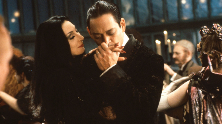 Anjelica Huston and Raul Julia as Morticia and Gomez Addams