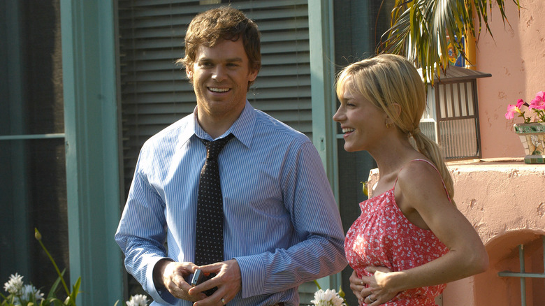 Dexter Morgan (Michael C. Hall) smiles next to Rita (Julie Benz) on Dexter