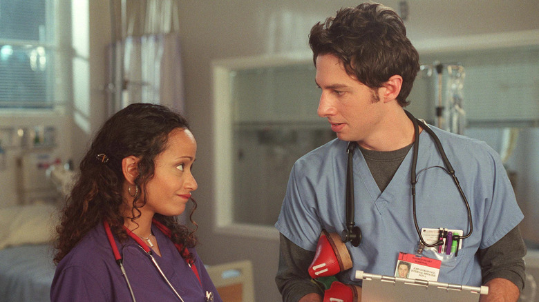 Carla (Judy Reyes) smiles at J.D. (Zach Braff) on Scrubs