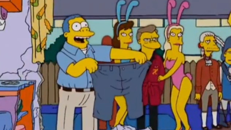 Chief Wiggum holding up large pants on The Simpsons